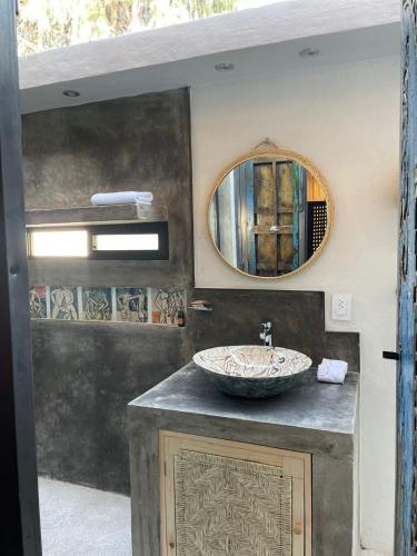 a bathroom with a sink and a mirror at Quinta Ascensión Hotel Boutique Only Adults in Malinalco