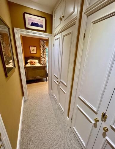 a hallway with a door leading to a bedroom at The Mill House in Santon