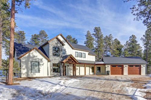 a large white house with a garage at The Cottonwood in Lead