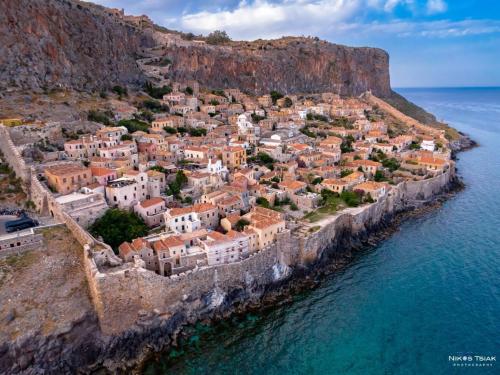 an aerial view of a town on a cliff at Ypatia Cozy Castle Suite Apartment with Loft in Monemvasia