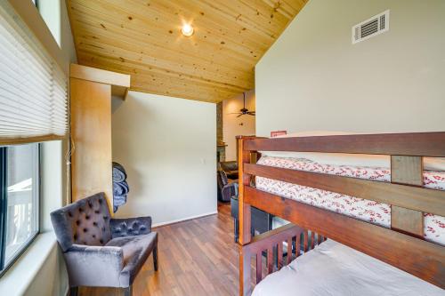 a bedroom with a bunk bed and a chair at Pine Mountain Club Home with Beautiful View! in Frazier Park