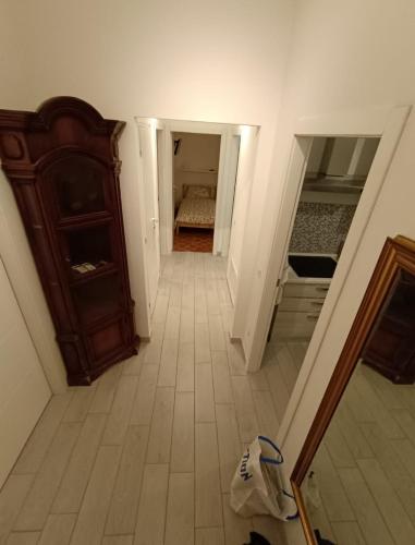 an empty hallway with a bedroom and a bed at Casa Maria in Opera