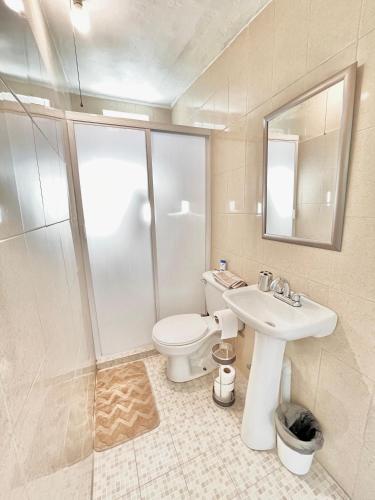 a bathroom with a toilet and a sink at Casita Costa Azul in San José del Cabo