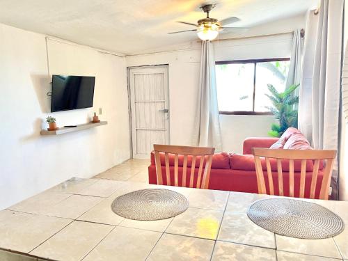 a living room with a table and two chairs at Casita Costa Azul in San José del Cabo