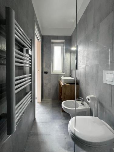 a bathroom with a toilet and a sink at Pinea b&b in Castellaneta Marina 
