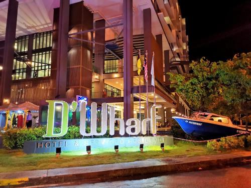 a hotel sign with a boat in front of a building at PD Seaview Sunset Cozy Staycation With Pool & Netflix, Private Unit, FIXED PRICE NO EXTRA FEE in Port Dickson