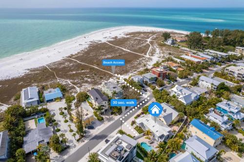an aerial view of a beach with condos at Approx 40 steps to beach entrance of Anna Maria beach in Anna Maria