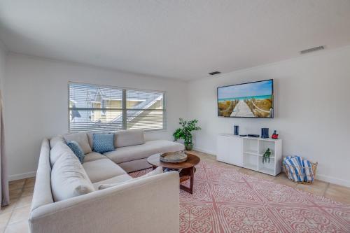 a living room with a couch and a table at Approx 40 steps to beach entrance of Anna Maria beach in Anna Maria