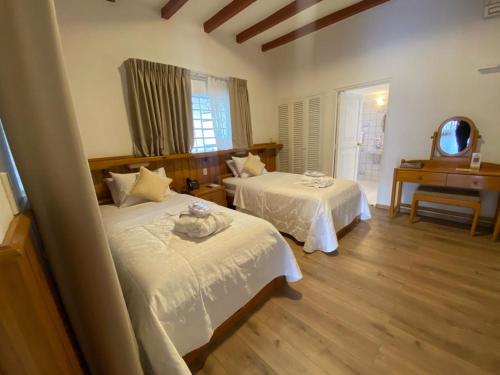 Katil atau katil-katil dalam bilik di HOTEL & SPA LAGUNA SECA