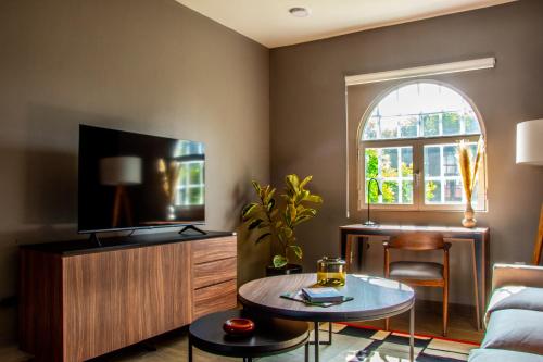 a living room with a couch and a table at HUATUSCO By Mr W in Mexico City