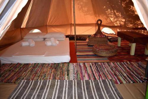 A bed or beds in a room at Glamping at a Lovely Tent in Skiaxtro- Marathopoli