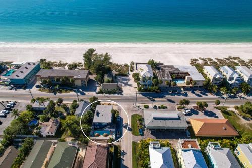an aerial view of a resort next to the beach at Seagrass Flats 2 offers prime location that in Bradenton Beach