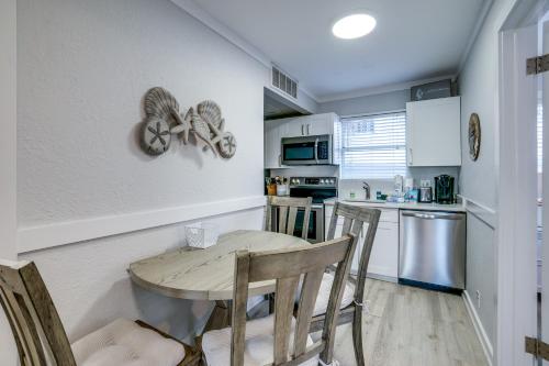 a kitchen with a table and chairs in a kitchen at Seagrass Flats 2 offers prime location that in Bradenton Beach