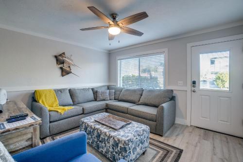 a living room with a couch and a ceiling fan at Seagrass Flats 2 offers prime location that in Bradenton Beach