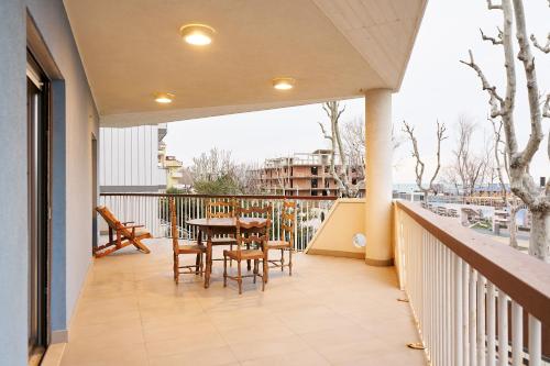 a balcony with a table and chairs on it at GRANDE TERRAZZA CON VISTA MARE parziale in Francavilla al Mare