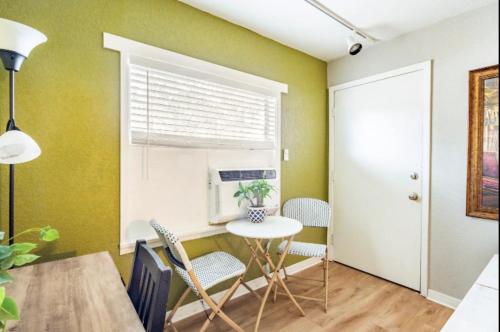 a dining room with a table and chairs and a window at 3-Bed Bungalow walk to Historic Downtown Sanford in Sanford