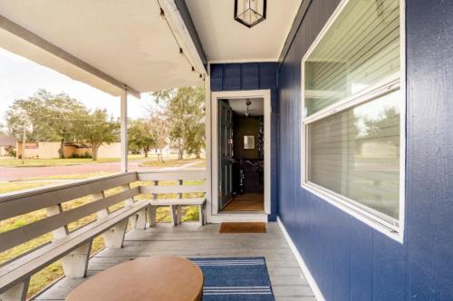 a porch of a house with a blue wall at 3-Bed Bungalow walk to Historic Downtown Sanford in Sanford