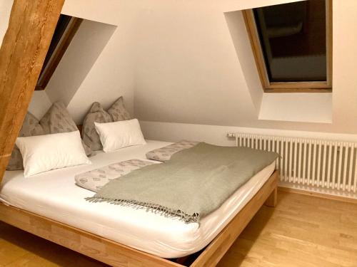 a bed sitting in a room with at Villa Riedhart in Kramsach