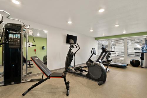 a gym with two exercise bikes in a room at WoodSpring Suites Fort Collins in Fort Collins