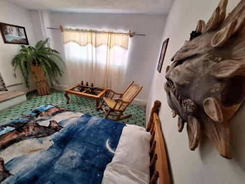 Postel nebo postele na pokoji v ubytování Hostal Casa Del Sol Comitan