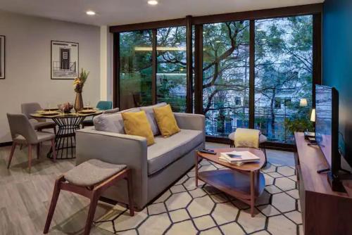 a living room with a couch and a table at VERACRUZ by MrW in Mexico City