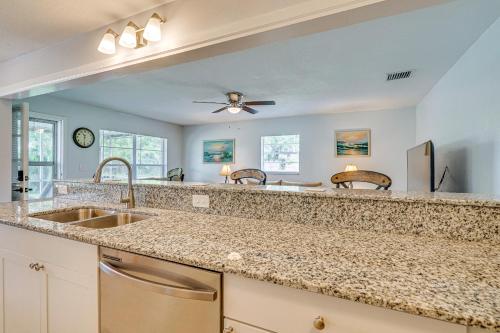 a kitchen with a sink and a ceiling fan at Newly Remodeled Home Less Than 2 Mi to Punta Gorda Airport in Punta Gorda