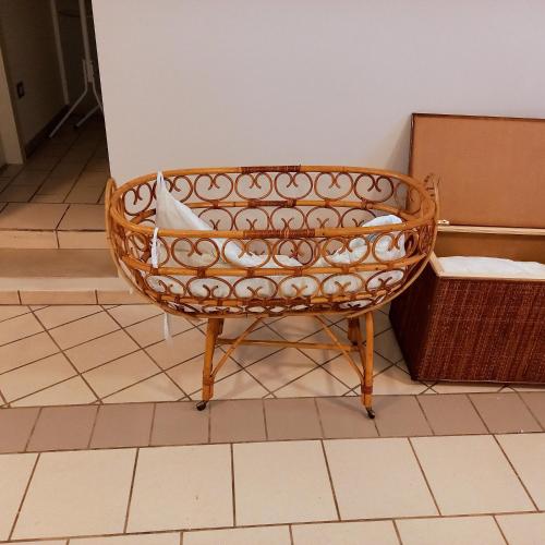 a wicker chair sitting in a room at Residenza Botticelli in Lecce