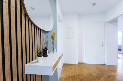 a room with a white table and a staircase at Große Terassen-Wohnung mit Grill, Playstation 5, Billardtisch und Massagesessel in Haan