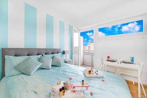 a bedroom with a bed with toys on it at Tiffany's Studio - Lugano in Style -By EasyLife Swiss in Lugano