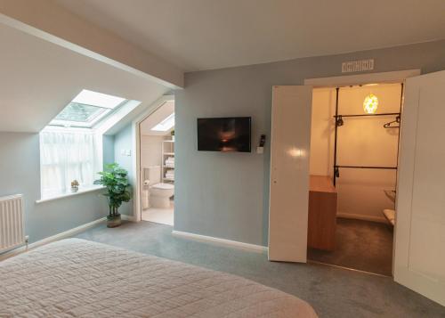 a bedroom with a bed and a bathroom at MOUNT BARKER in Swords