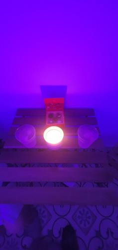 a room with a purple light and some stairs at La Morería y su jacuzzi in La Puebla de los Infantes
