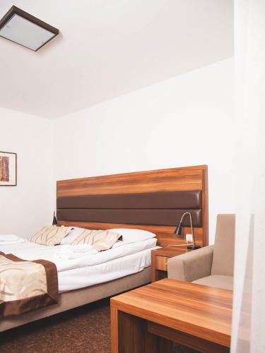 Ένα ή περισσότερα κρεβάτια σε δωμάτιο στο Hotel Beskidian