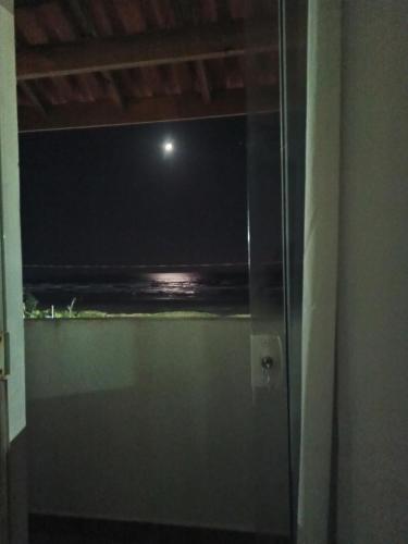 a view of the ocean from a bathroom window at Sea Capitain Pousada e Restaurante in Peruíbe