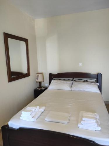 a bedroom with a bed with two towels on it at Comfortable Apoikia house for 2 in Apoíkia