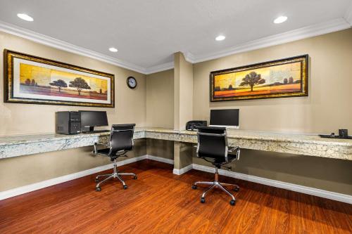 a waiting room with two desks and two chairs at Best Western Moreno Hotel & Suites in Moreno Valley