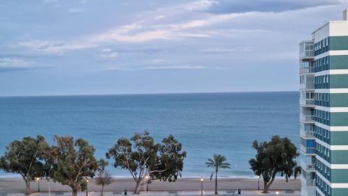 a view of the beach from the balcony of a building at Stunning sea vistas by the beach in Benicàssim