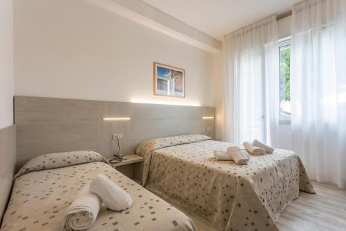 Postel nebo postele na pokoji v ubytování Hotel Dafne