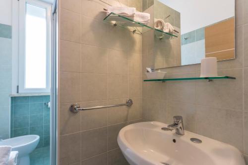 Koupelna v ubytování Hotel Dafne