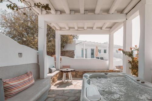 a hot tub on the patio of a house at Villa Konstantin in Mýkonos City