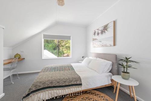 Ένα ή περισσότερα κρεβάτια σε δωμάτιο στο The Lake Hideaway on Kendall