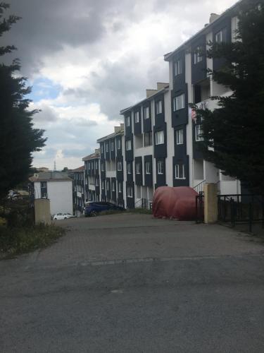 an empty parking lot in front of a building at Stay in nature-5 mins to airport in Arnavutköy