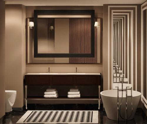 ein Badezimmer mit einer Badewanne, einem Waschbecken und einem Spiegel in der Unterkunft GoldenEye Hotel & Casino in Svilengrad