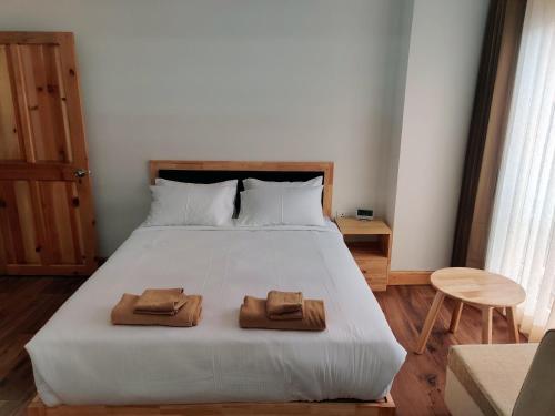 Ein Bett oder Betten in einem Zimmer der Unterkunft Happy apartment
