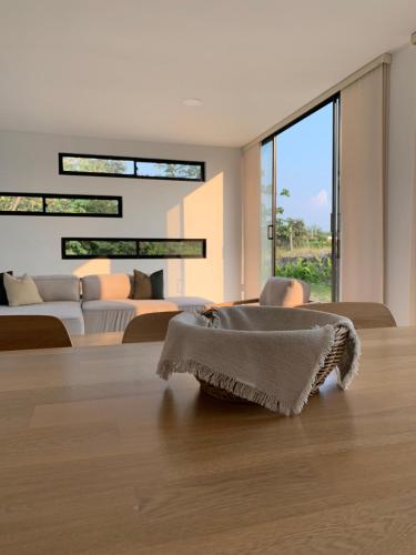 a living room with a rug on the floor at Casa Sentido - Tu refugio campestre in Alvarado