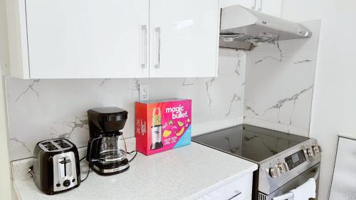 a book is sitting on a counter in a kitchen at 3bed 1 bath suite - Surrey Fleetwood in Surrey