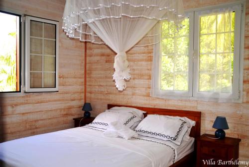 Postel nebo postele na pokoji v ubytování Villa Barthélemy