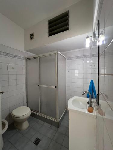 a bathroom with a shower and a toilet and a sink at Departamento PH 4 ambientes La perla a 5 cuadras de playa in Mar del Plata