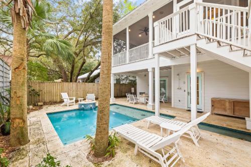 a villa with a swimming pool and a house at Serenity Now - Private Pool,5 Bikes,Gulf Views, Steps to the Beach and Seaside! in Seagrove Beach
