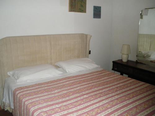 A bed or beds in a room at Agriturismo Villalba