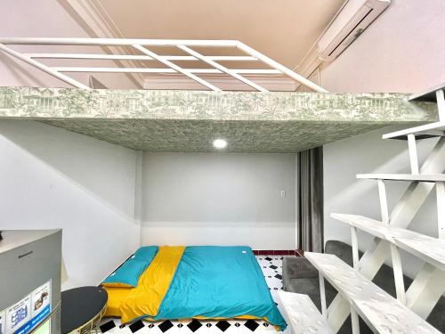 a bedroom with a bunk bed in a room at Phuc Khang Apartment in Ho Chi Minh City